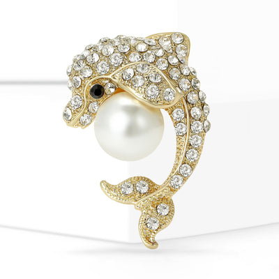 Front view of curved dolphin holding a round pearl like bead