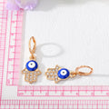Gold and Silver Tone Crystal Hamsa Evil Eye Huggie Earrings view 4