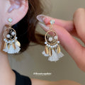 Pearl Circle White Tassel Drop Earrings with Gold Tone Details view 1