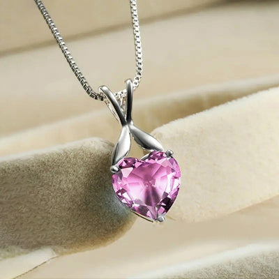 Pink heart stone silver leaf-bail pendant on beige cushion with box chain