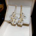 Cascading Crystal Petal Drop Earrings with Reflective Details view 1