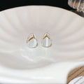 Clear Teardrop Silver Tone Sculptural Huggie Earrings view 4