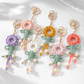 Gold Tone Woven Flower Doll Clip Keychains in Six Colors view 1