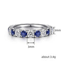 Blue And Clear Round Stone Eternity Band In Silver Tone view 4