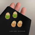 Gold Tone Crackle Oval Stud Earrings In Green And Champagne view 1