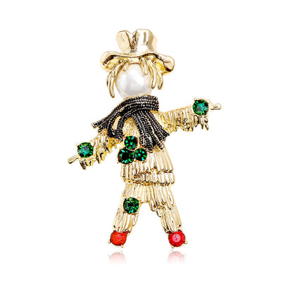 Front product view of the scarecrow brooch pin in gold