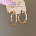 Gold Tone Twisted Medium Hoop Earrings with Detailed Finish view 6