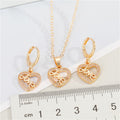 Gold Tone Crystal LOVE Heart Pendant Necklace and Huggie Earrings view 2