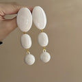 White Oval Cascade Statement Drop Earrings For Distinctive Statement Styling view 3