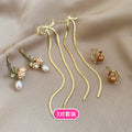 Gold Tone Pearl Butterfly Bow Earring Three Pair Sets view 7