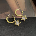 Gold Tone Clear Star and Stone Huggie Hoop Earrings view 2