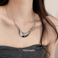 Sculptural Curved Pendant Necklace in Gold and Silver view 1
