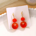 Orange Bead Open Disc Gold Tone Long Hook Earrings view 2