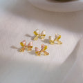 Gold Edge Enamel Bow Stud Earrings Pink Cream White view 1