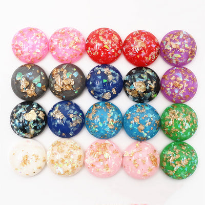 Round cabochons arranged assortment on a white background