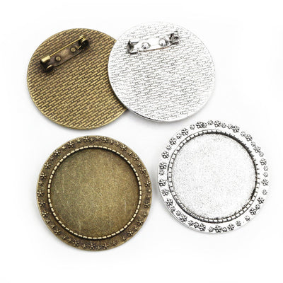 round cabochon brooch settings arranged together on a white background