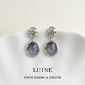 Silver Tone Openwork Top And Blue Gray Round Stone Stud Earrings view 1