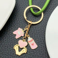 Eight Pink Baby Bottle Outfit and Footprint Keychain Designs view 2