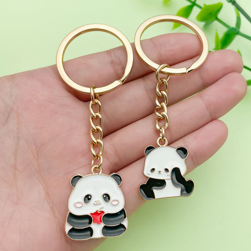 Image 2 showing a pair of panda and heart shaped key chains.