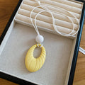 Pastel Oval Textured Pendant Necklace in Four Soft Colors view 9