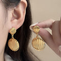 Ridged Double Round Disc Drop Earrings in Gold Tone view 4