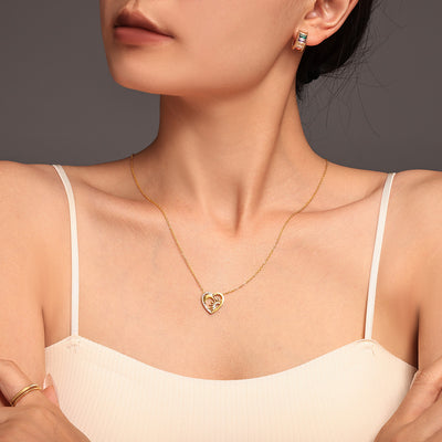 Gold heart sun moon pendant necklace on model