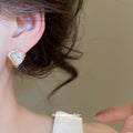 Gold Tone Heart Crystal Huggie Earrings With Decorative Details view 3