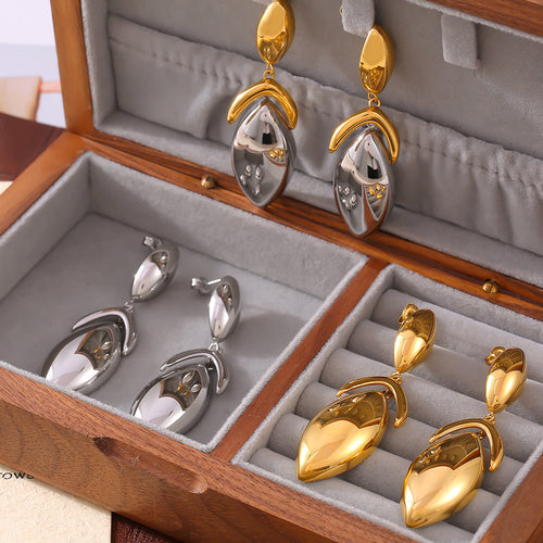 Gold two-tone and steel leaf drop earrings in wood jewelry box