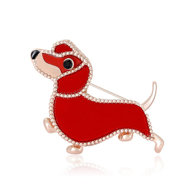 Front view of playful red enamel dachshund brooch with crystal trim