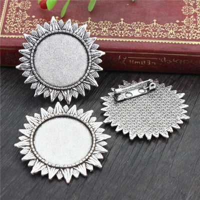 Sunflower Round Cabochon Brooch Base in Antique Silver shown in a grouped front view