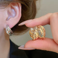 Interlocking Double Hoop Clip On Earrings in Gold and Silver view 2