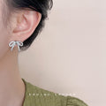 Silver Tone Clear Stone Ribbon Bow Stud Earrings With Pave Finish view 2
