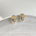 Gold Tone Blue Aqua And Clear Stone Chunky Huggie Hoop Earrings view 4