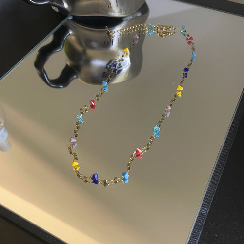 Multicolor Beaded Station Necklace on Gold Tone Chain shown in a display view
