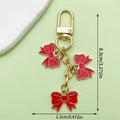 Three Bow Charm Keychain in Red or Blue with Gold Tone Clasp view 3