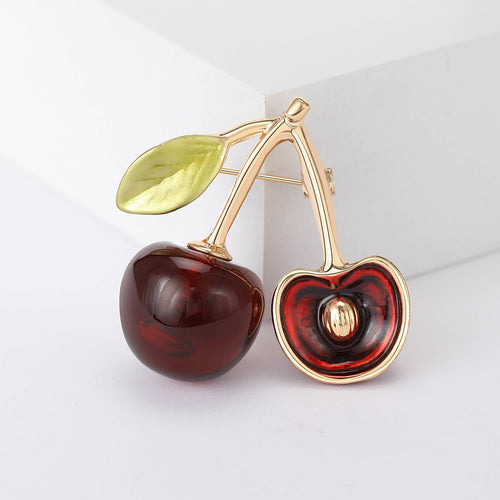Enamel cherry pair brooch front on white blocks