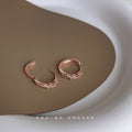 Rose Gold Knot Huggie Hoop Earrings Micro-Set Clear CZ view 4