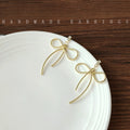 Gold Textured Wire Long Tail Bow Stud Earrings Pair view 4