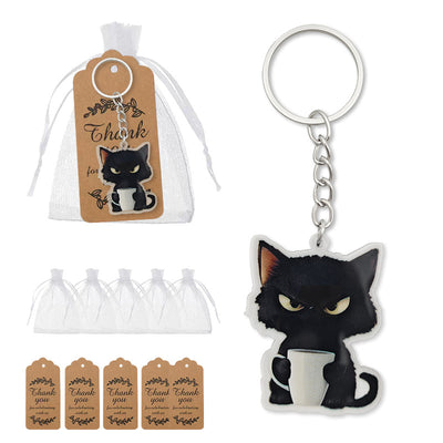 Black cat cup keychain displayed beside a white drawstring bag and brown thank you tags.