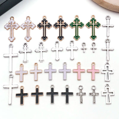 Colorful cross charms arranged on a light background