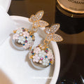 Gold Tone Butterfly Floral Ball Drop Earrings With Polished Metal Details view 3
