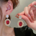 Red Oval Halo Two-Tier Long Drop Earrings In Gold Tone view 3