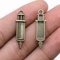 Short Syringe Double-Sided Metal Charm in Two Antique Finishes view 3