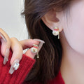 Gold Tone Lucky Pouch Stud Earrings with Red Accent view 6