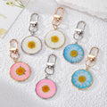 Round Resin Daisy Keychains Gold Silver Frames 6 Styles view 1