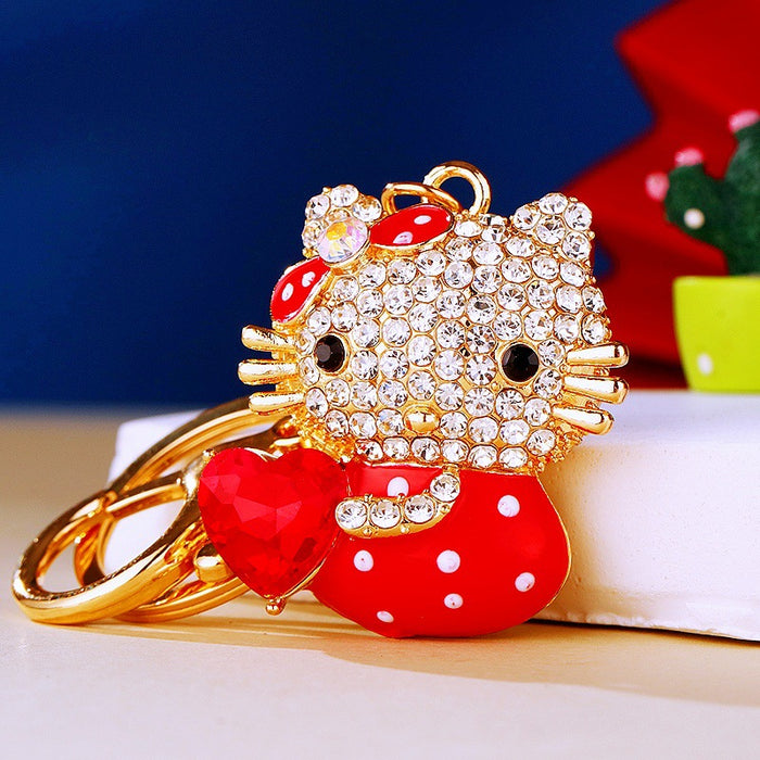 Jeweled Bow Cat Keychains Holding Heart-Shaped Gems in Four Colors