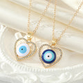 Gold Tone Crystal Open Heart Realistic Eye Pendant Necklaces view 1