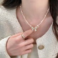 Pink Pearl Strand Necklace With Crystal Bow Pendant view 2