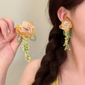 Peach Fabric Flower and Green Fringe Earrings with Decorative Details view 4