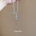 Layered White Pearl Look Cross Pendant Necklace with Metal Tone Details view 4